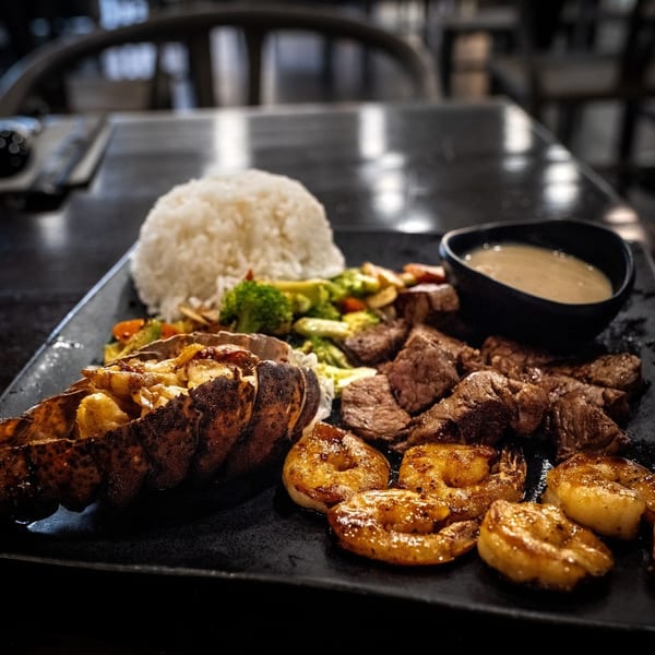 Surf and turf platter with lobster, steak, shrimp and rice