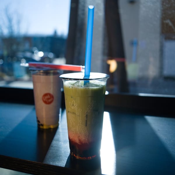 Taro boba with tapioca pearls on a wooden table